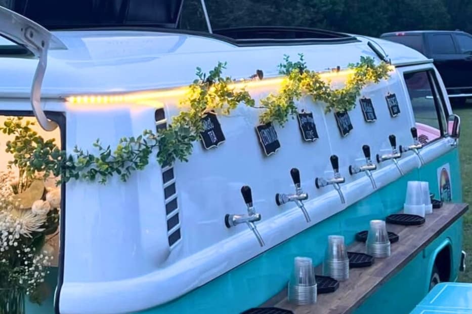 Teal and white VW T2 beer tap truck with eucalyptus garland and LED lighting